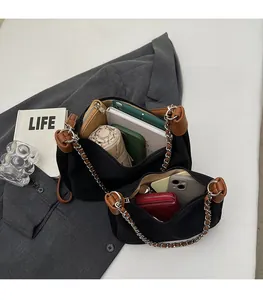 Detailed top view of black tote bag interior showing large capacity for daily items