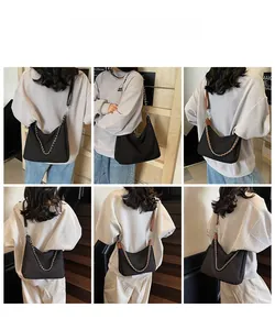 Detailed views of a large black soft shoulder bag with metal chain and wide strap