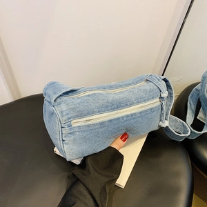Sac cylindre en jean bleu clair rétro avec double fermeture éclair et franges