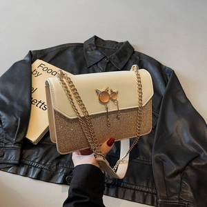 Sac à chaîne bicolore à la mode avec paillettes dorées et boucle bijou en forme de chat