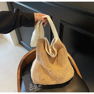 Large woven tote bag with hollow design and two-tone拼接 styling in beige and white