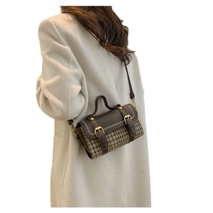 Chic houndstooth plaid tote bag with brown leather accents and adjustable strap for women