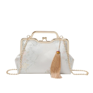 Vintage silver silk evening bag with bamboo embroidery and elegant champagne tassel