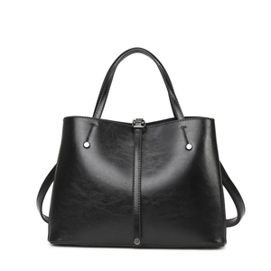 Vintage black faux leather tote bag with glossy finish and silver hardware details