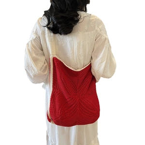Red and white handmade crochet tote bag with bohemian star pattern and wide shoulder strap
