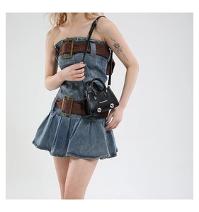 Chic mini black crossbody handbag styled with denim dress for fashion look