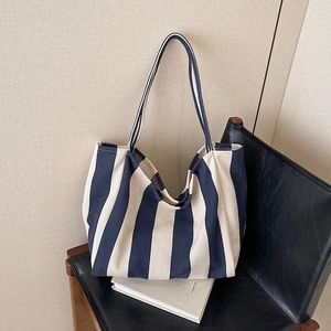 Minimalist striped canvas bucket tote bag with large capacity for daily use