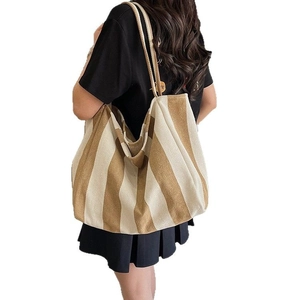 Striped canvas bucket tote bag in khaki and beige stripes for daily commute