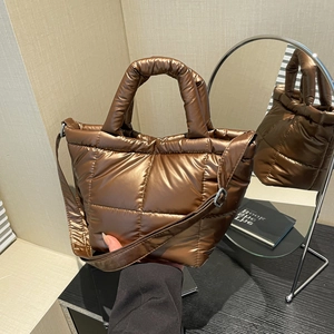 Chic bronze quilted tote bag with metallic finish and adjustable strap for daily fashion