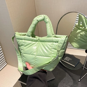 Chic light green quilted nylon handbag with top handle and crossbody strap for women