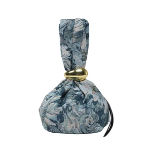 Retro jacquard bucket bag with blue floral pattern and gold teardrop metal ring