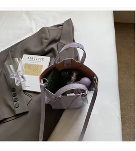 Lavender bucket bag interior view showing high capacity for phone, umbrella, and cosmetics