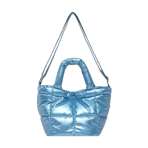 Sky blue quilted puffer tote bag with metallic glossy finish and adjustable strap