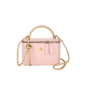 Pink patent leather mini bag with gold arch handle and adjustable gold ball chain