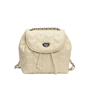 Quilted cream backpack with heart patterns, silver twist lock and chain straps