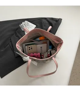 Top view of spacious pink tote bag interior showing ample storage for daily essentials