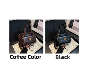 Detail view of coffee and black vintage handbags with glossy leather and metal lock