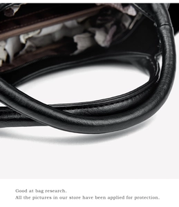 Detailed macro view of the premium black leather handle with reinforced stitching