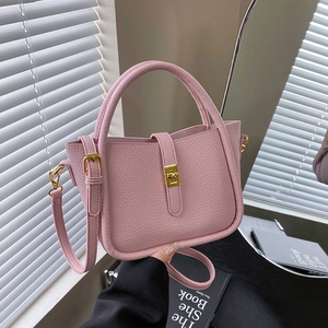 Pink litchi texture handbag with gold hardware and adjustable strap for women
