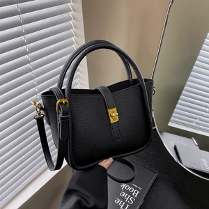 Litchi pattern black leather tote bag with gold twist lock and shoulder strap