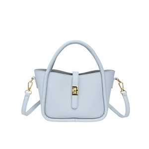 Light blue lychee pattern leather handbag with gold buckle and adjustable strap