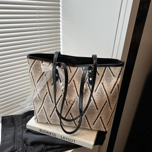 Chic woven tote bag with geometric diamond pattern and elegant pearl bow charm