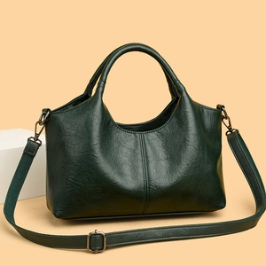 Dark green leather handbag with embroidery and adjustable shoulder strap in 2025 style