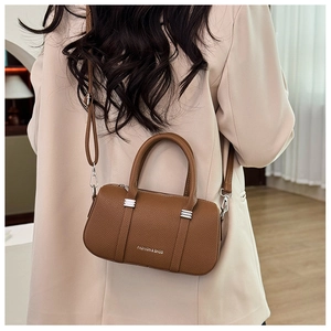 Rear view of brown litchi pattern leather handbag with white fashion lettering print