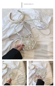 Macro view of handmade white pearl woven bag with floral pattern and crossbody chain