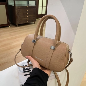 Minimalist camel cylinder boston bag with litchi texture and silver hardware details