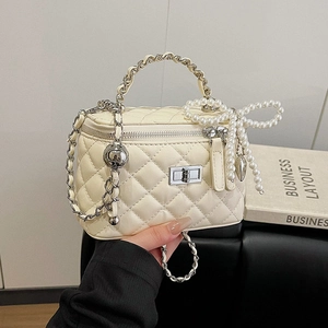 White quilted chain crossbody bag with silver twist lock and pearl bow charm detail