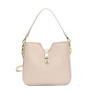 Minimalist beige crossbody bag with gold lock and adjustable strap on white background