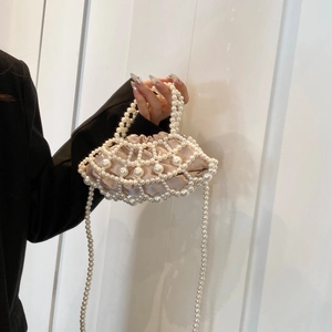 Elegant pearl woven crossbody bag with satin lining and double pearl chain handle