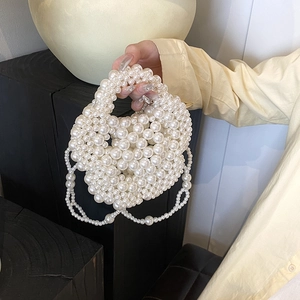 Handmade cream pearl woven handbag with elegant fringe detail for evening party use