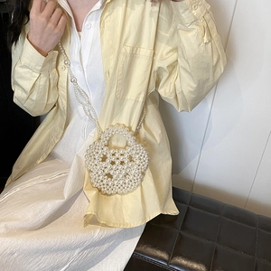 Handmade white pearl woven round crossbody bag with sphere structure and long shoulder strap