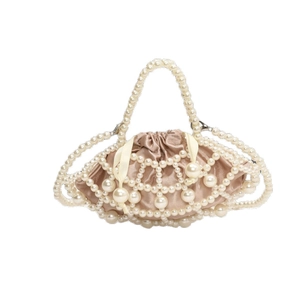 Elegant pearl beaded handbag with champagne satin drawstring liner and woven top handle