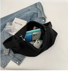 Top view of large black tote bag interior showing space for tablet and smartphones