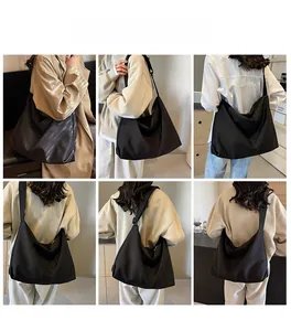 Detailed views of the large black hobo shoulder bag shown on a model from various angles