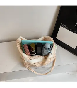 Top view of striped knit tote bag showing spacious interior with phone and wallet