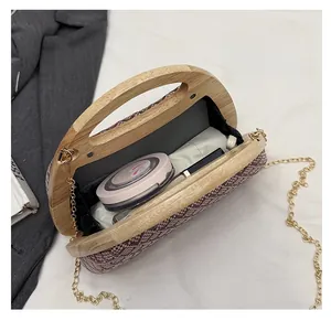 Detail view of woven evening clutch interior showing space for lipstick and cosmetics