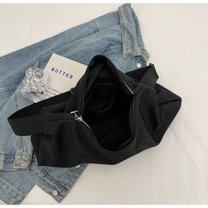 Top view of large nylon tote bag interior showing zipper pocket and spacious main compartment
