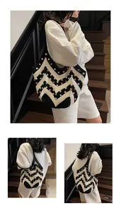 Detail view of woven tote bag with monochrome chevron pattern and multi-colored pearls