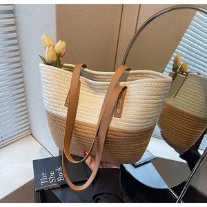 Detail of hand-woven cotton tote bag with premium leather handles and cross-stitch reinforced seams