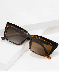 Detail of tortoise shell square sunglasses with anti-blue light gradient lenses on white steps