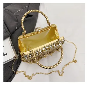Detailed macro view showing gold rhinestone evening bag interior with luxury satin lining