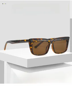 Detailed close-up of dark tortoise shell texture on thick square sunglass frames