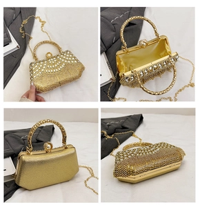 Macro view of gold evening bag with rhinestones, pearl clasp, and metal chain details