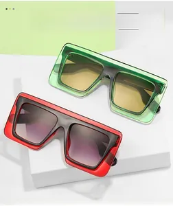 Detail view of stylish square sunglasses with double-layered frames and gradient lenses