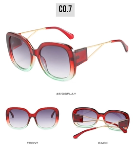 Detail of red and green gradient square sunglasses with hollow gold metal temples