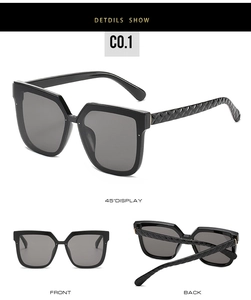 Detail view of square black sunglasses featuring unique textured quilted pattern temples